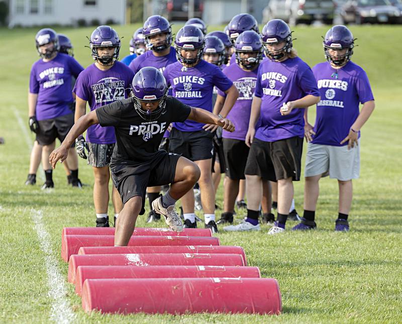 Dixon football runs through drills Tuesday, August 8, 2023 during the first week of IHSA allowed football practice.