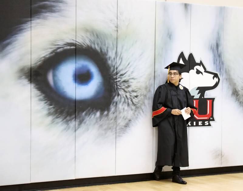 Batavia High School graduate Tommy Altamirano waits to line up for the 2022 Batavia High School Commencement Ceremony at the Northern Illinois University Convocation Center in DeKalb on Wednesday, May 25, 2022.