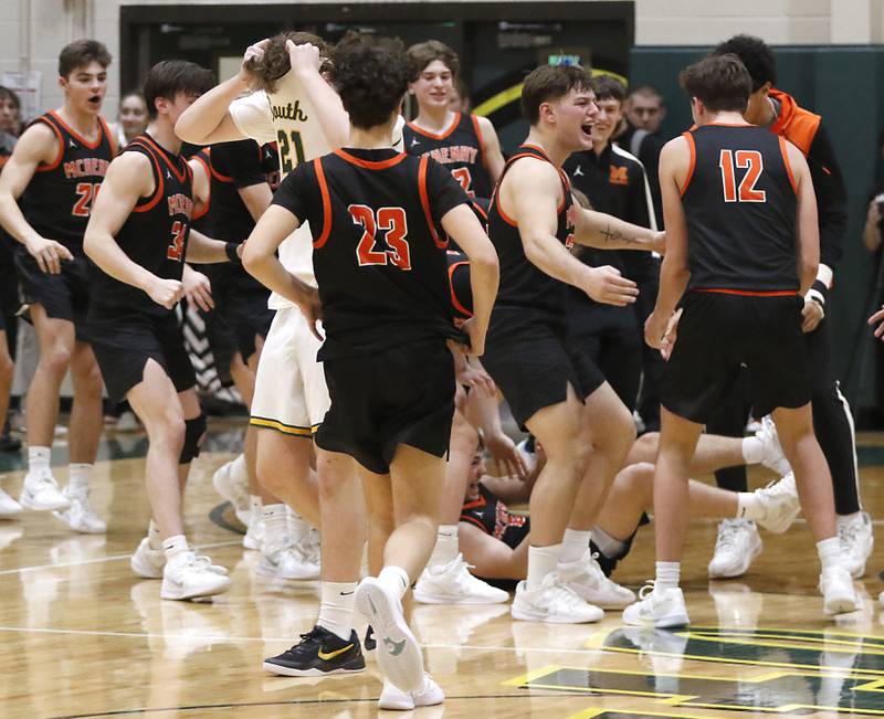Crystal Lake South's Ryan Morgan is surrounded by McHenry players as they celebrate their win over Crystal Lake South in  a Fox Valley Conference basketball game on Friday, Jan. 31, 2025, at Crystal Lake South High School.