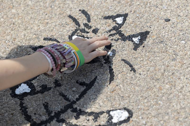 Emma Collinson was using her fingertips to color in the fine feline Sunday, July 21, 2024 during Tampico Days.