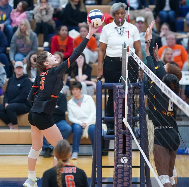 Lincoln-Way West's Caroline Smith (5) plays the ball against Joliet West during a class 4A Oswego Sectional semifinal match at Oswego High School on Monday, Oct. 30, 2023.