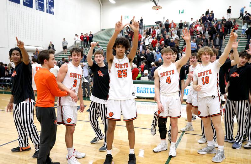 Wheaton Warrenville South players wave to thier fan section following their Class 4A Bartlett Sectional semifinal win over Benet on Wednesday, March 2, 2022.