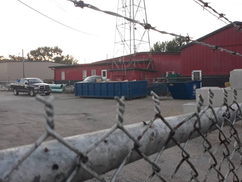 A yard waste receptacle for Spring Valley residents sits within a fenced-in area Monday, June 20, 2022, of the city's building on North Taylor and West First streets. The receptacle will be moved outside of the fencing to allow residents more access to it.