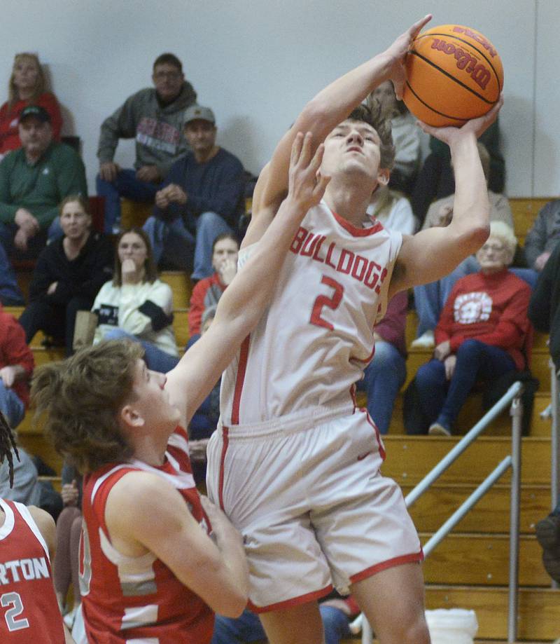 Streator’s Matt Williamson goes over Morton’s Collin Burns for a shot in the 2nd period Wednesday at Streator.