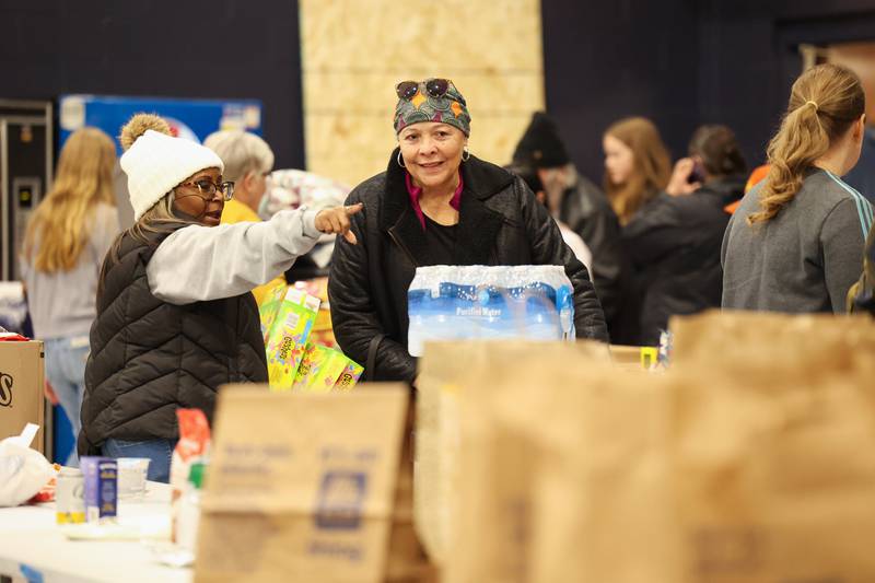 Gloria Smith, of Aroma Park, gathers supplies at Grace Christian Academy on Thursday, March 12, 2026, following the EF-3 tornado that tore through Kankakee County on March 10. Smith said her home's roof was significantly damaged and is staying with her daughter.