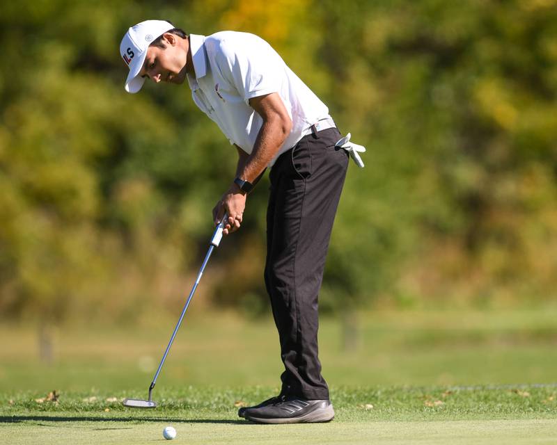 Hinsdale Central's Dru Devata putts on Monday Oct. 7, 2024, during the 3A sectional match held at Blackberry Oaks Golf Course in Bristol.