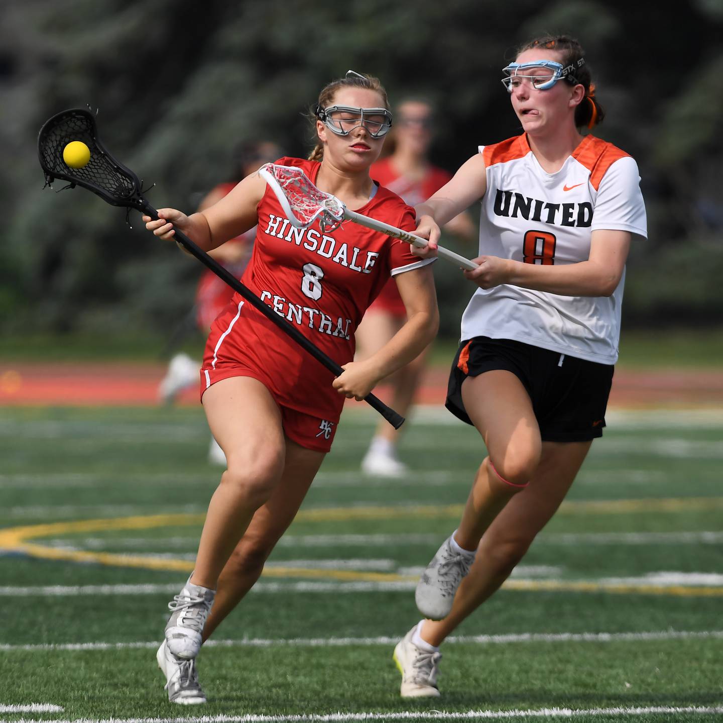 Crystal Lake Central Coop’s Izzy Jackson, right, tries to take the ball from Hinsdale Central’s Addison Linn during the third-place game of the girls lacrosse state finals at Hinsdale Central High School on Saturday, June 7, 2025.