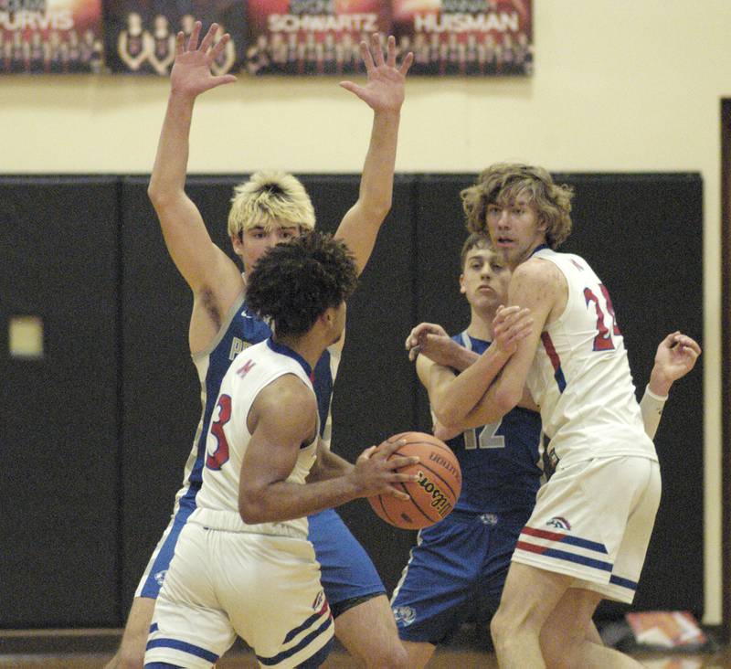 Morrison's Daeshaun Johnson looks to get the ball to Brenden Johnson during the Morrison vs Princeton class 2A basketball regional final at Prophetstown High School on Friday, Feb. 23 .