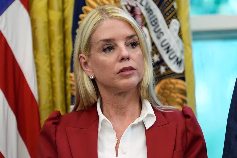 Attorney General Pam Bondi listens as President Donald Trump signs a presidential memorandum on the death penalty in the District of Columbia in the Oval Office at the White House, Thursday, Sept. 25, 2025, in Washington. (AP Photo/Alex Brandon)