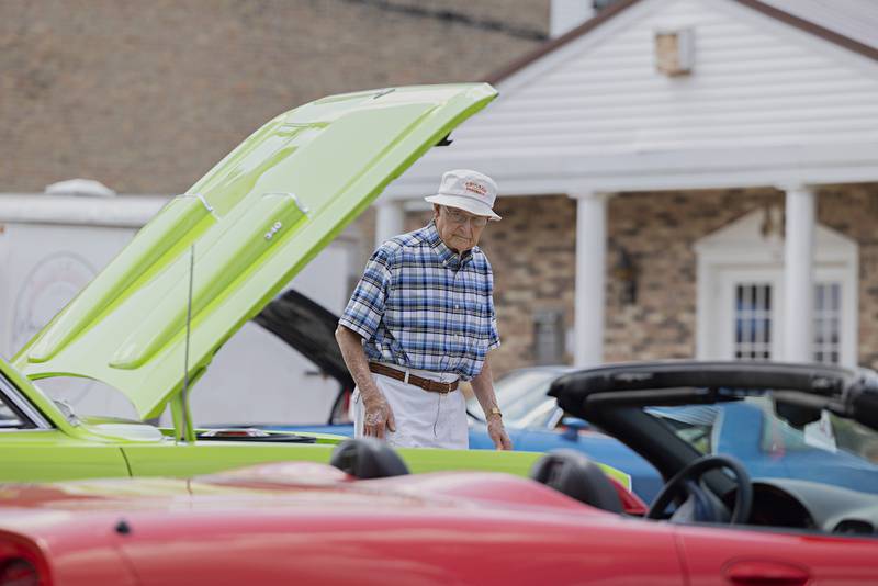 Ronald Church of Tampico checks out some of the unique rides on display at the Tampico Days car show Saturday, July 22, 2023.