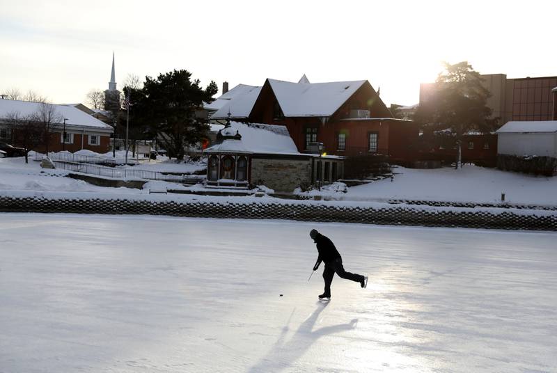 Tom Edwards of Batavia was one of the first onto the ice at the Batavia Depot Pond after several days of sub-freezing weather. The Batavia Park District declares the ice safe for skating once it reaches eight inches or greater of ice.