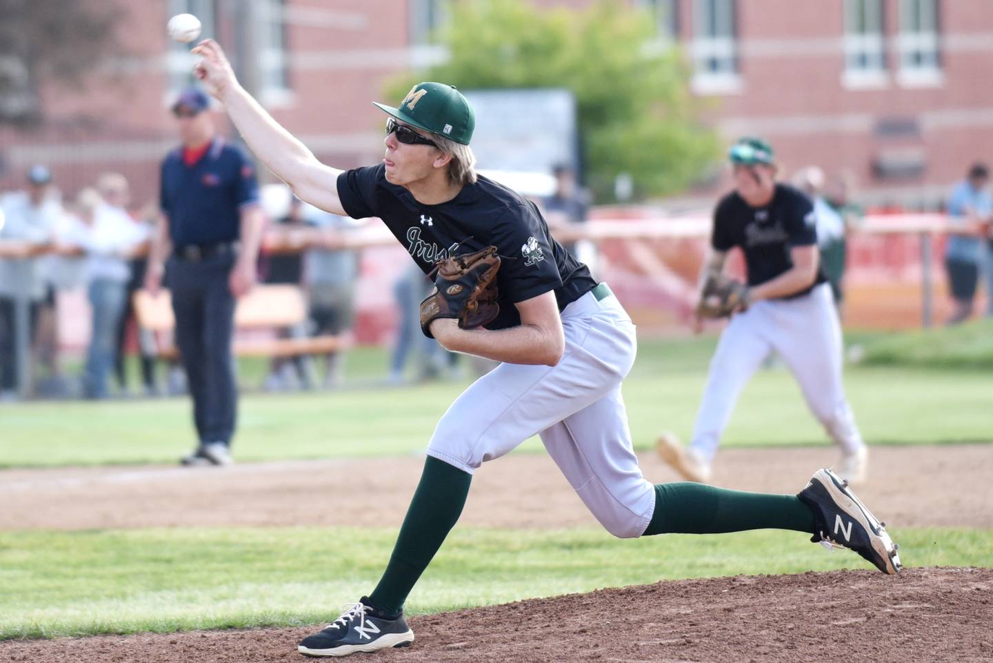 Bishop McNamara's Callaghan O'Connor throws a pitch during the Class 2A Beecher Sectional semifinals against Manteno Thursday, May 29, 2025.