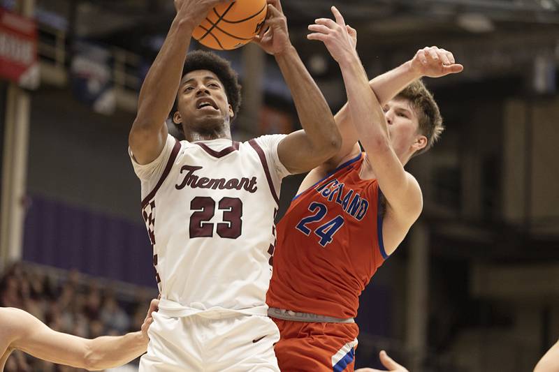 Tremont's Brandon Tennon grabs a rebound in front of Eastland's Harper Keim Monday, March 9, 2026, in the Class 1A Macomb Supersectional.