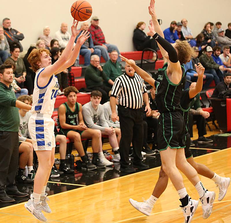 Princeton's James Starkey (24) shoots a jump shot over Rock Falls defenders during the Colmone Classic on Tuesday, Dec. 6, 2022 at Hall High School in Spring Valley.