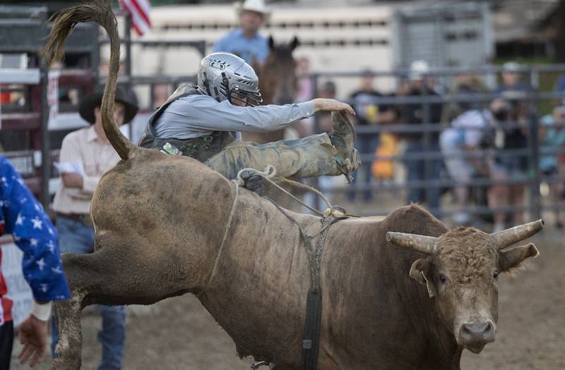 Perry Schrock gets bucked off his bull Tuesday, August 15, 2023 in the Next Level Pro Bull Riding event at the Whiteside County Fair.