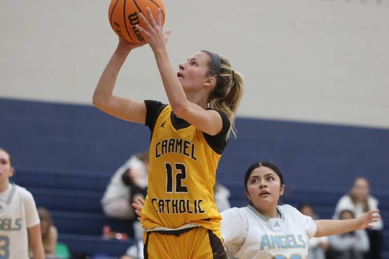 Carmel’s Josie Hartman puts up a shot against Joliet Catholic on Wednesday, Jan 15, 2025 in Joliet.