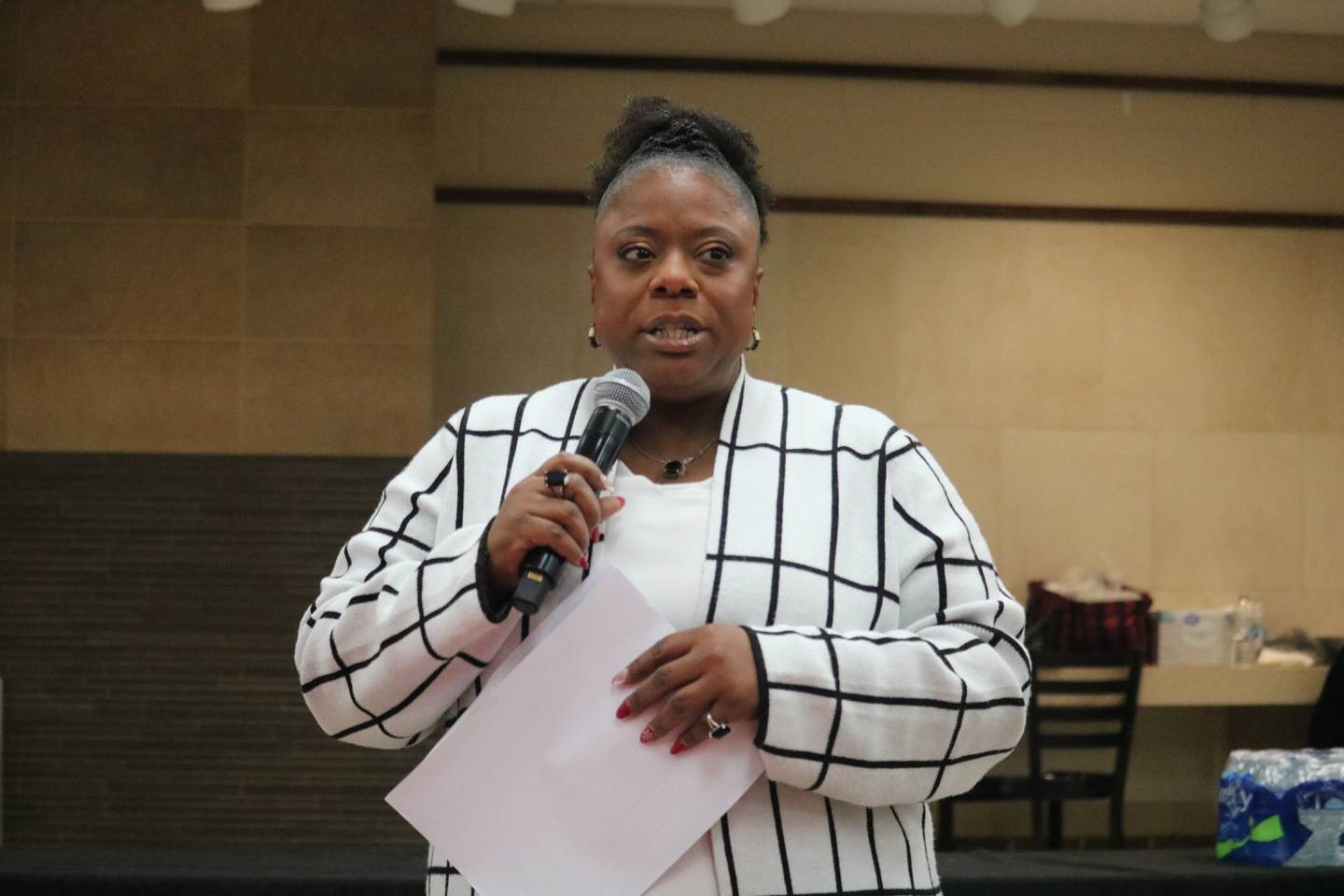 DeKalb School District 428's Director of Diversity Equity and Inclusion Amonaquenette Parker offers remarks Jan. 9, 2025, at a community conversation held at DeKalb High School.
