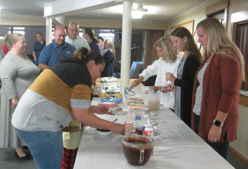 Plano Methodist Church members dish up their favorite ice creams and toppings with servers Kathy Martinez, Sera Wyncoop and Kathy Martinez at the church's annual ice cream social held Sept. 10, 2023.