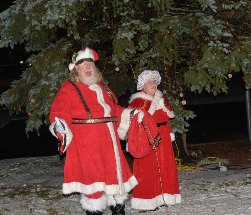 Santa and Mrs. Claus countdown the lighting of tree at Memorial Park during Christmas in the Country on Friday, Dec. 1, 2023.
