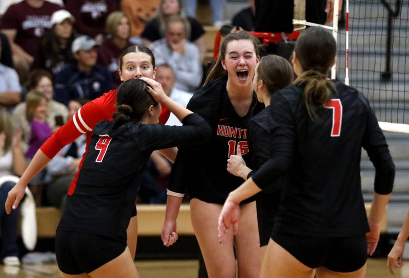 Huntley's Sienna Robertson celebrates a point with her teammates on the way to defeating Prairie Ridge during a Fox Valley Conference volleyball match on Tuesday, Oct. 8, 2024, at Huntley High School.