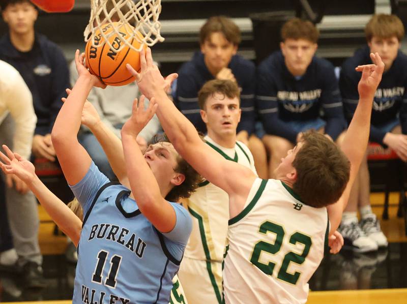 Bureau Valley's Blake Foster runs in the lane to score over St. Bede's AJ Hermes during the Colmone Classic on Thursday, Dec. 11, 2025 at Hall High School.