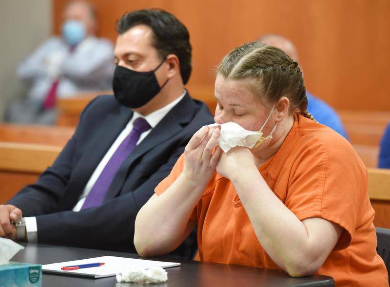 JoAnn Cunningham, 37, cries and wipes her nose during a sentencing hearing in Woodstock Thursday, July 16, 2020. With her is Public Defender Angelo Mourelatos. She pled guilty in December to killing her five-year-old son A.J. Freund Jr. in April, 2019 in her Crystal Lake home. His body was found in a shallow grave in Woodstock.