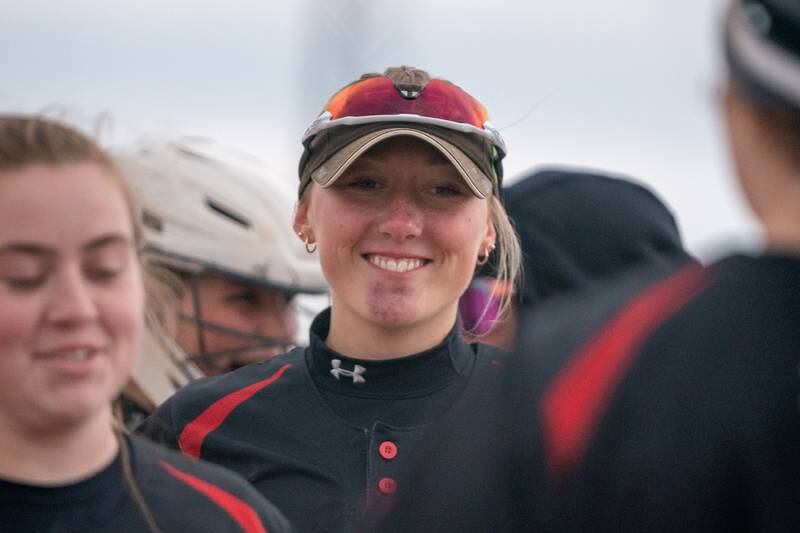 Yorkville's Madi Reeves (2) smiles as she leaves the field after striking out the side against Oswego during a softball game at Oswego High School on Tuesday, April 25, 2023.