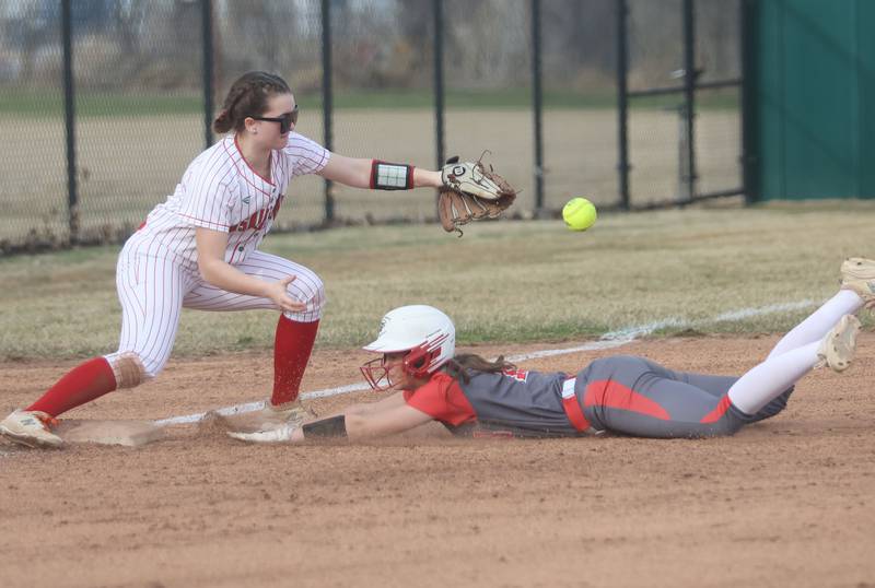 Morton's Hailey Bassett slides under the tag of L-P's Makenzie Chamberlain on Friday, March 20, 2026 at the L-P Athletic Complex in La Salle.