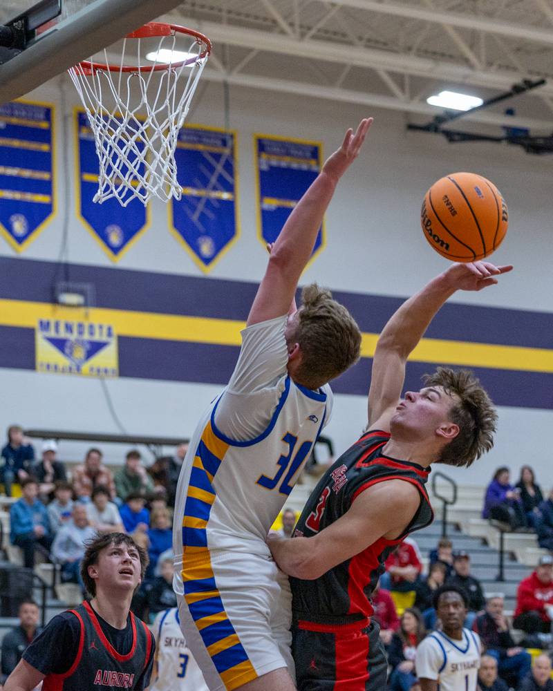 Jayce Schmitt (30) of Johnsburg attempts to lay up ball as Aurora Christian's Preston Morel (3) blocks shot during the Class 2A Boys Sectional Basketball tournament game on Wednesday, March 4, 2026 at Mendota High School.