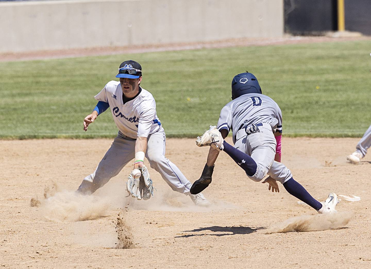Newman’s Nolan Britt stabs for the ball as a Chicago Hope player steals second Monday, May 29, 2023.
