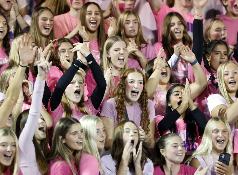 Downers Grove North fans cheer during the varsity football game between Downers Grove North and Lyons Township on Friday, Oct. 11, 2024 in Downers Grove.