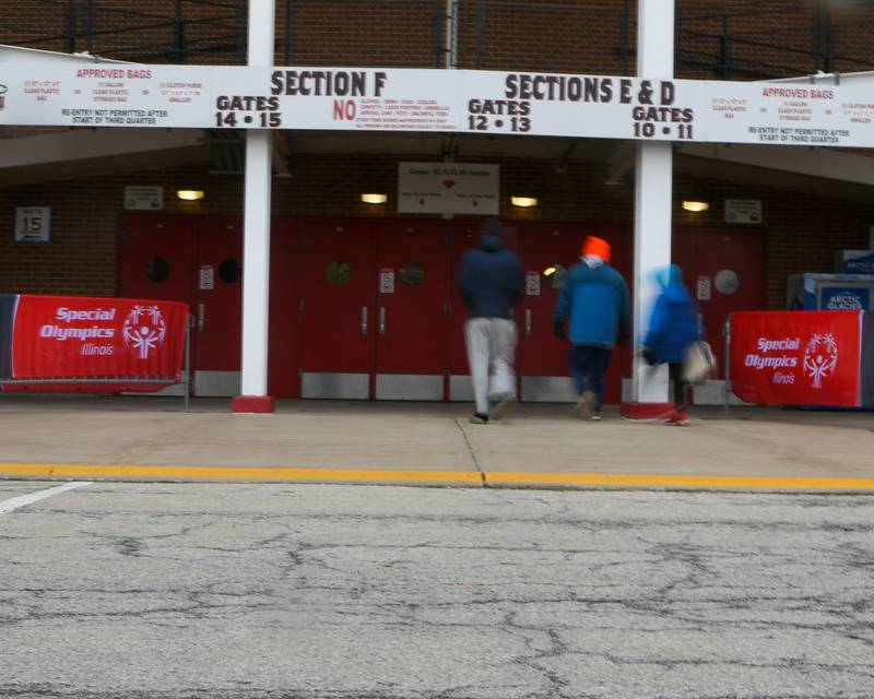Participants of the polar Plunge enter Huskie Stadium in DeKalb on Saturday Feb. 21, 2026, before the start of the plunge.