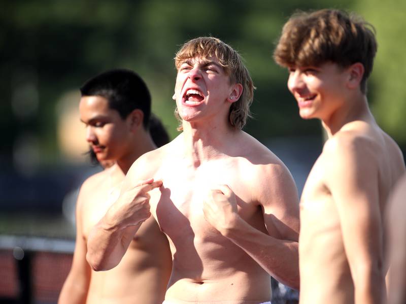 Jovan Cerny of Oswego East celebrates after competing in the watermelon eating competition as part of the annual "Battle of the Big Butts" Linemen Challenge at West Aurora High School on Thursday, July 13, 2023.