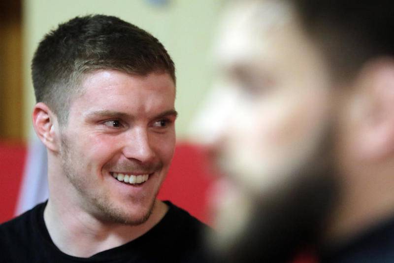 Wrestling instructors Trevor Jauch (left) and Jon Murphy watch as students warm up at Old School Wrestling Training Center in 2018 in Huntley. Murphy, a former wrestling coach at Johnsburg and Crystal Lake Central, coached Jauch to three state championships for Crystal Lake Central.