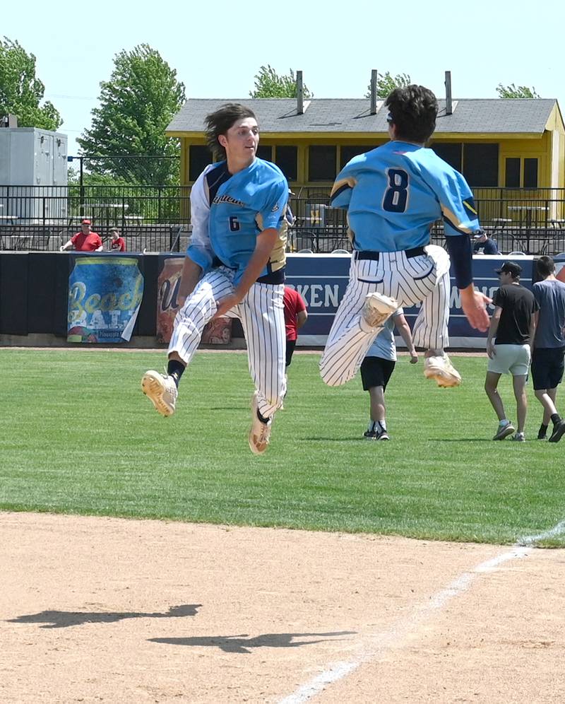 Marquette's Primo Pattelli (6) and Carson Zellers (8) lep and celebrate their supersectional win over Newman Monday. The team defeated Newman 12-1 in 5 innings.
