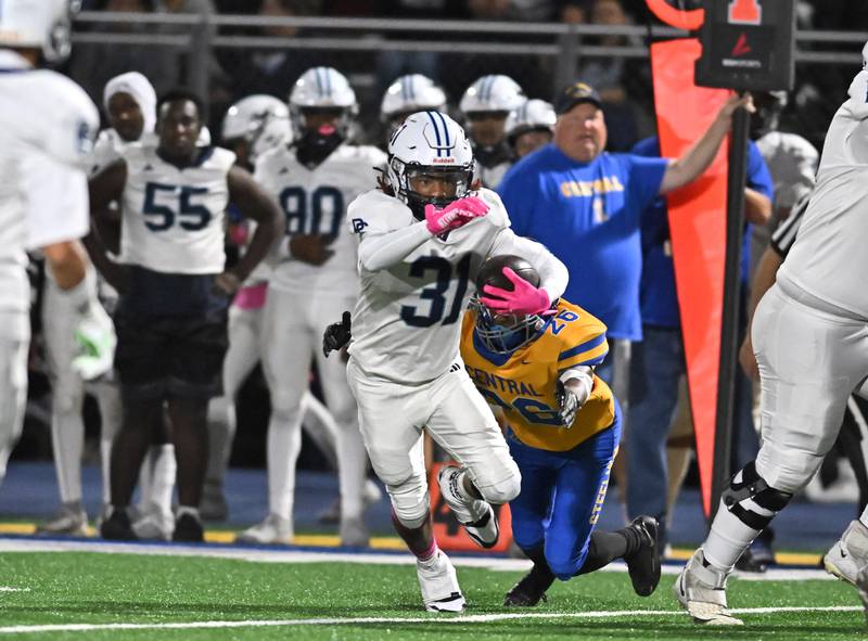 Plainfield South's Sincere Rodgers (31) breaks into the secondary during the conference game against Joliet Central on Friday, OCT. 17, 2025, at Joliet.