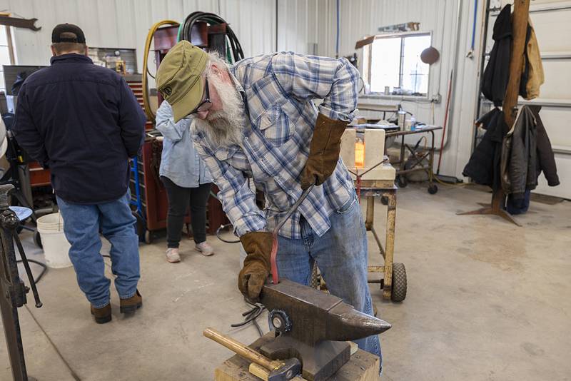 Undeterred, Mark Stach continues with his plan to pay homage to the victims of the bridge collapse by constructing a cross with the metal pulled from the Rock River.