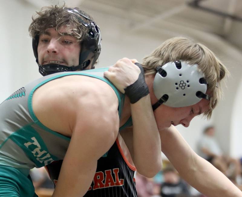 Woodstock North’s Olin Wiedel, front, battles Crystal Lake Central’s Jackson Marlett at 120 pounds in boys wrestling IHSA Class 2A Regional championship bout action on Saturday, Jan. 31, 2026, at Harvard High School in Harvard.