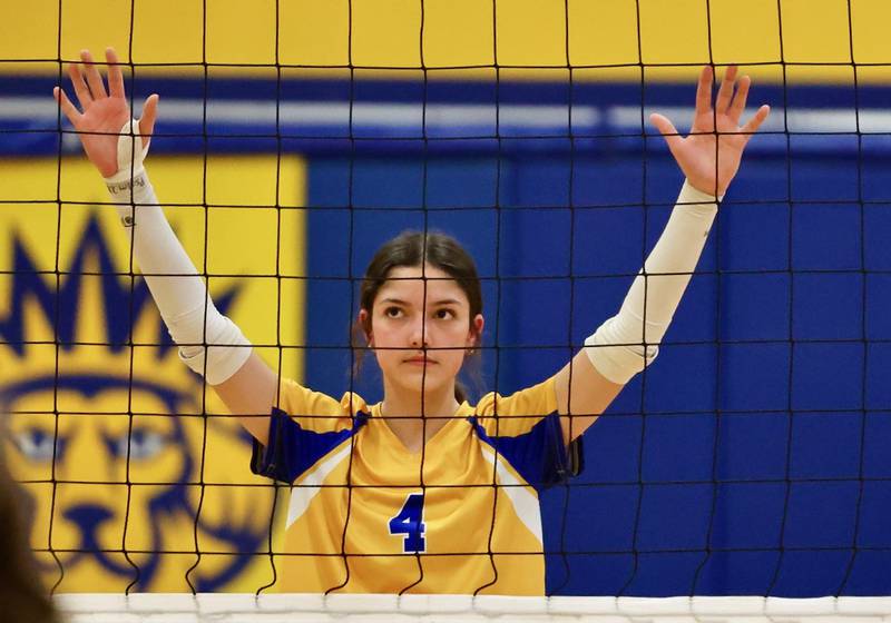Lenora Hopkins stands ready at the net for Princeton Logan in Monday's Class 3A 8th grade sectional finals at Pannebaker Gym. The Lions fell in three sets to Morris Saratoga.