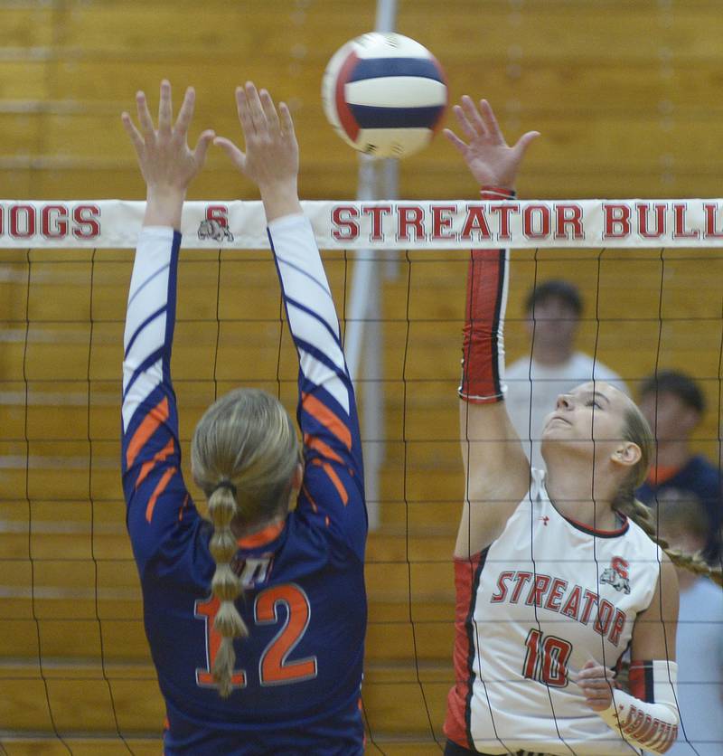Streator’s Shaelyn  Groesbeck reaches to get the ball past Pontiac’s Morgan Dewald in the first set Wednesday at Streator.