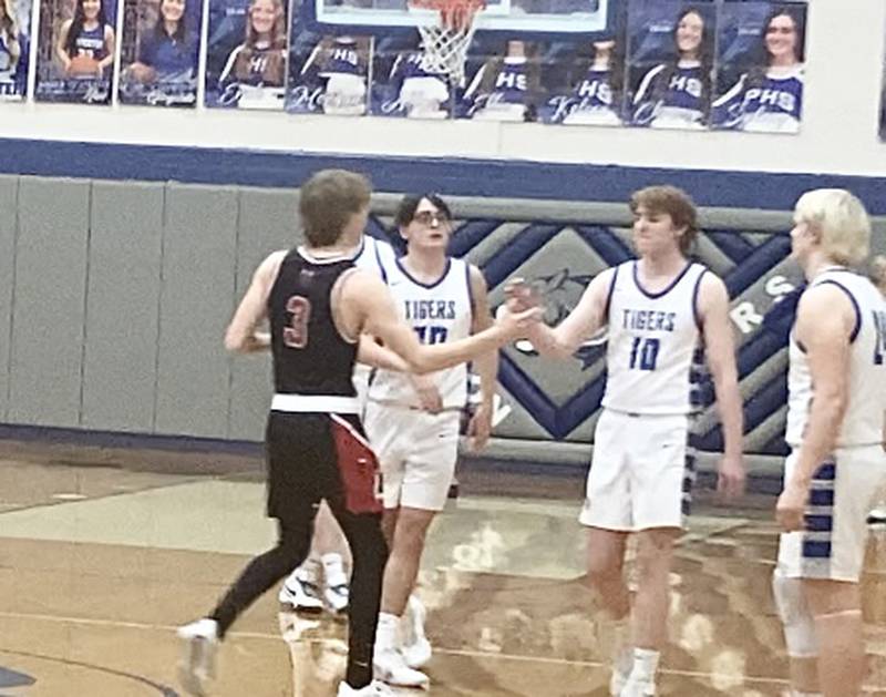 Princeton senior Jimmy Starkey gets a hand shake and hug from Hall senior Max Bryant. Starkey, who sustained a season-ending knee surgery in the first game of the year, drew the Senior Night start.