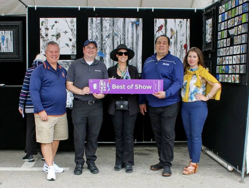 Artist Karri Jamison (center) poses with her Best of Show award at the St. Charles Fine Arts Show with (from left) St. Charles Mayor Clint Hull, St. Charles Bank & Trust Vice President Drew Kotche and President Michael Trimarco, and Alderperson Jayme Muenz.