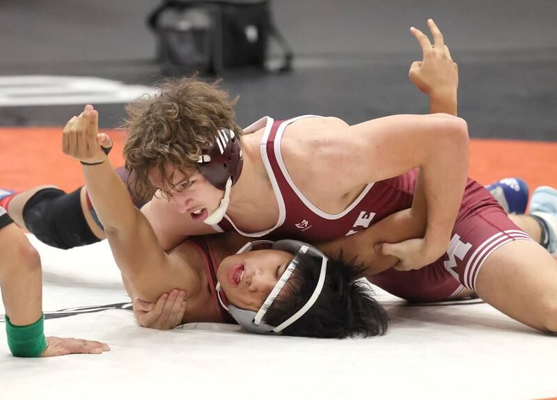 Moline’s Pablo Perez tries to pin South Elgin’s Paul Bayna in a 170 pound match Wednesday, Nov. 23, 2022, during a quad at DeKalb High School.