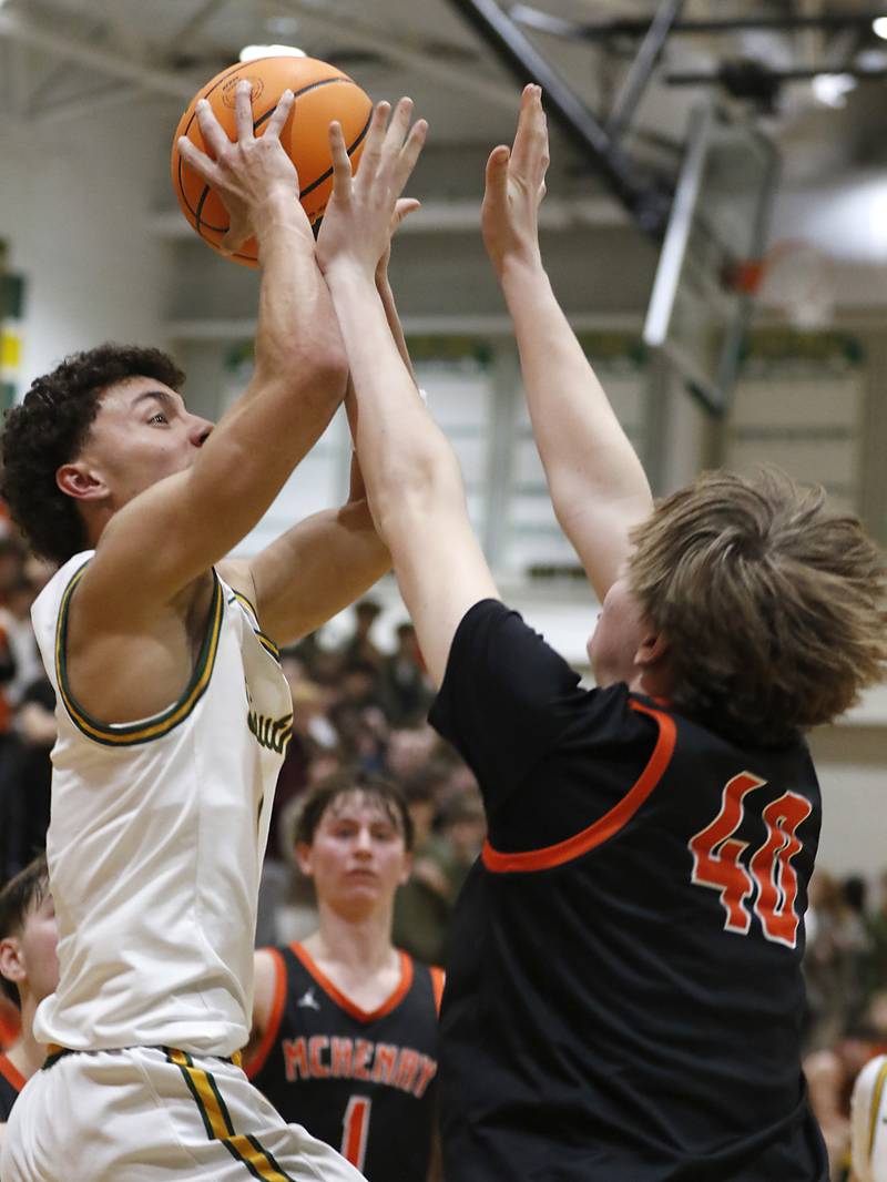 Crystal Lake South's Anthony Demirov drives to the basket against McHenry's Nate Ottaway during a Fox Valley Conference basketball game on Friday, Jan. 31, 2025, at Crystal Lake South High School.