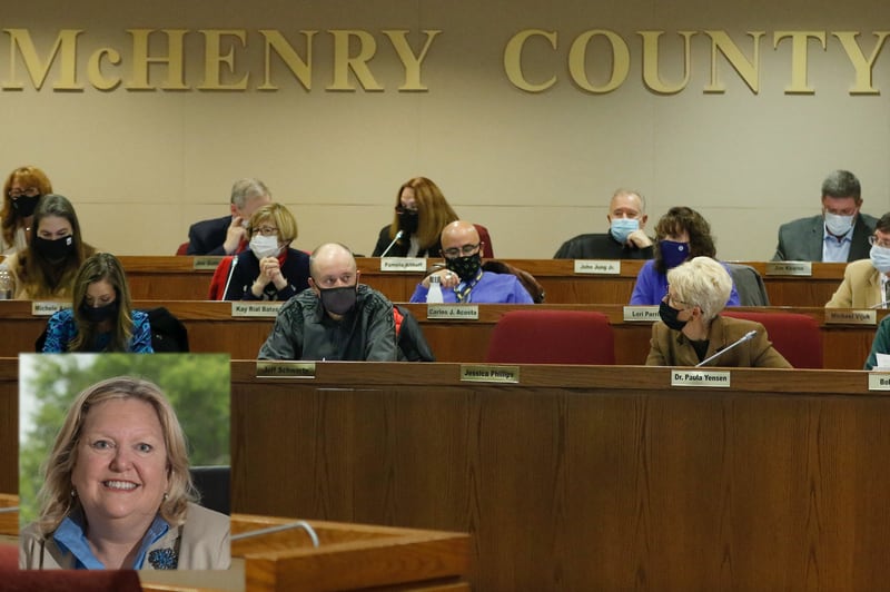 The McHenry County Board votes during a regular meeting of the McHenry County Board on Tuesday, Nov. 16, 2021, inside the McHenry County Administration Building in Woodstock. The McHenry County Board voted unanimously to remove current elected official Leslie Schermerhorn, pictured in inset, from her elected role of regional superintendent of schools.