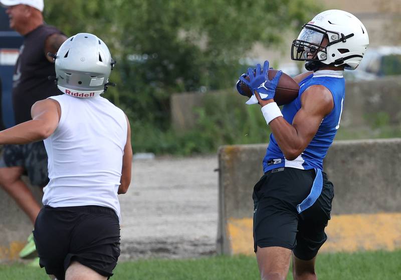 Geneva’s Talyn Taylor catches a touchdown pass Tuesday, July 16, 2024, during their matchup with Kaneland in the Kaneland 7-on-7 at the school in Maple Park.