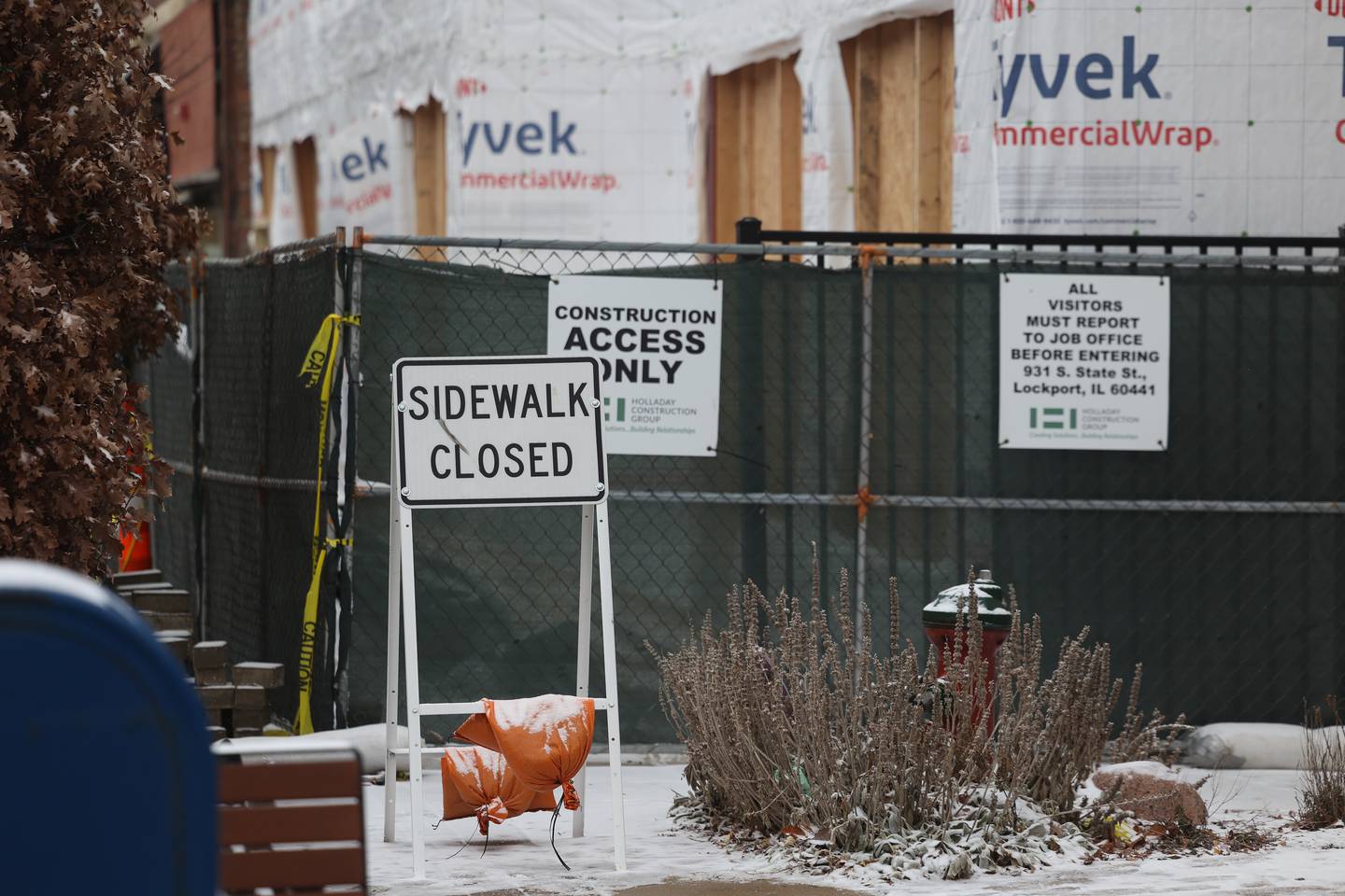 The sidewalk is closed along State Street in downtown Lockport as a mixed use building is under construction on Monday, Jan. 6, 2025.