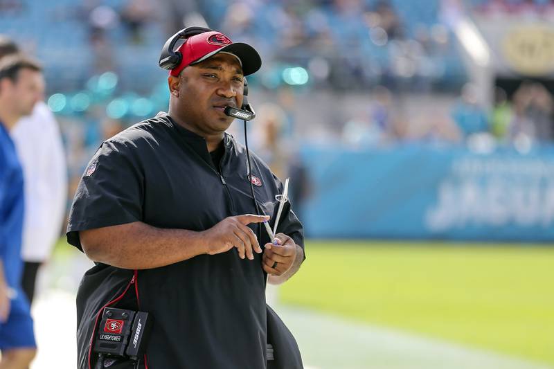 FILE - San Francisco 49ers special teams coordinator Richard Hightower talks on his headset during the first half of an NFL football game against the Jacksonville Jaguars, Sunday, Nov. 21, 2021, in Jacksonville, Fla. The Chicago Bears hired Hightower as special teams coordinator under new coach Matt Eberflus on Sunday, Feb. 6, 2022. (AP Photo/Gary McCullough, File)