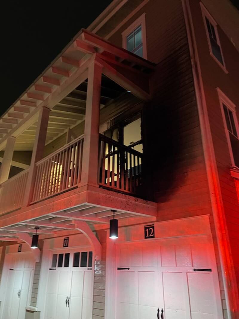 Exterior of a building in the 1300 block of Mews Lane in Romeoville after a balcony fire was extinguished.