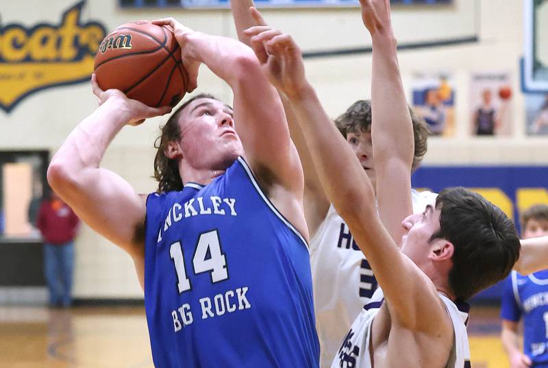 Hinckley-Big Rock's Martin Ledbetter shoots over two Serena defenders Friday, Feb. 3, 2023, during the championship game of the Little 10 Conference Basketball Tournament at Somonauk High School.